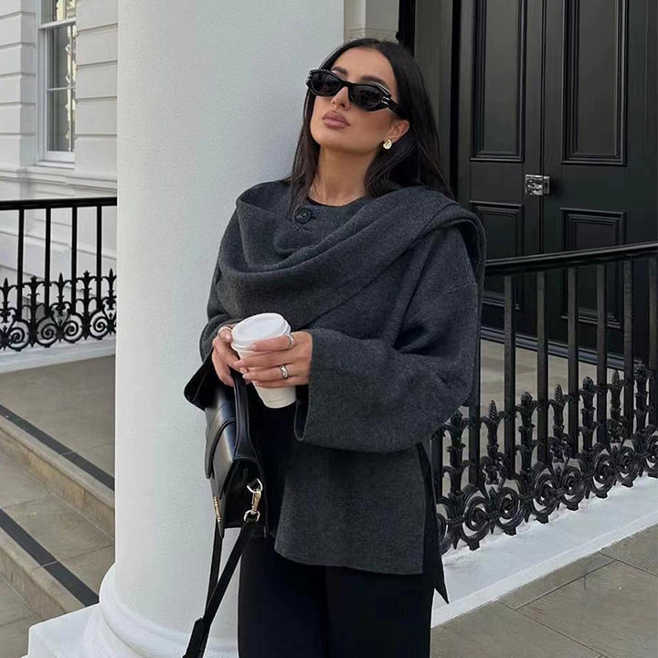 Woman wearing knit cardigan coat with asymmetric scarf detail