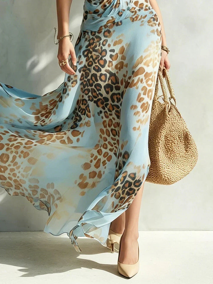 Woman wearing leopard halter neck maxi dress