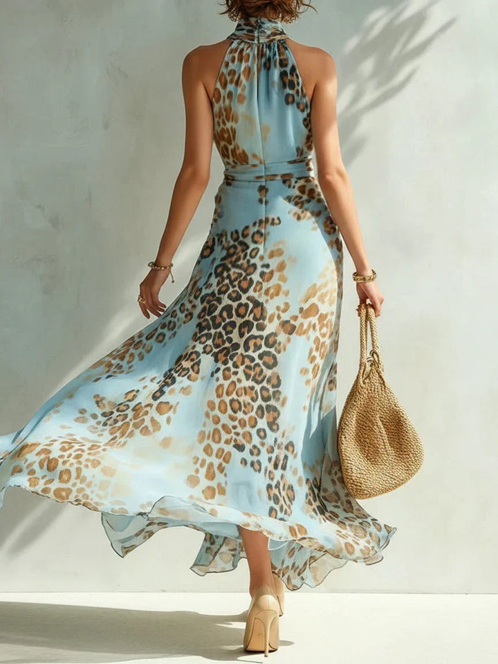 Woman wearing leopard halter neck maxi dress