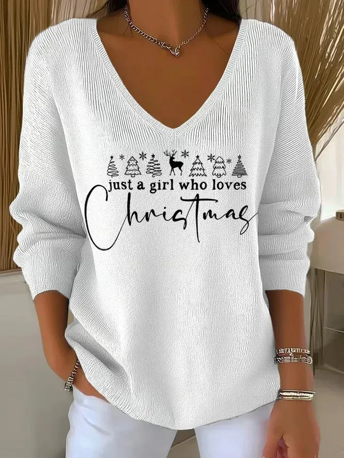 Woman wearing V-neck Christmas sweater with festive print