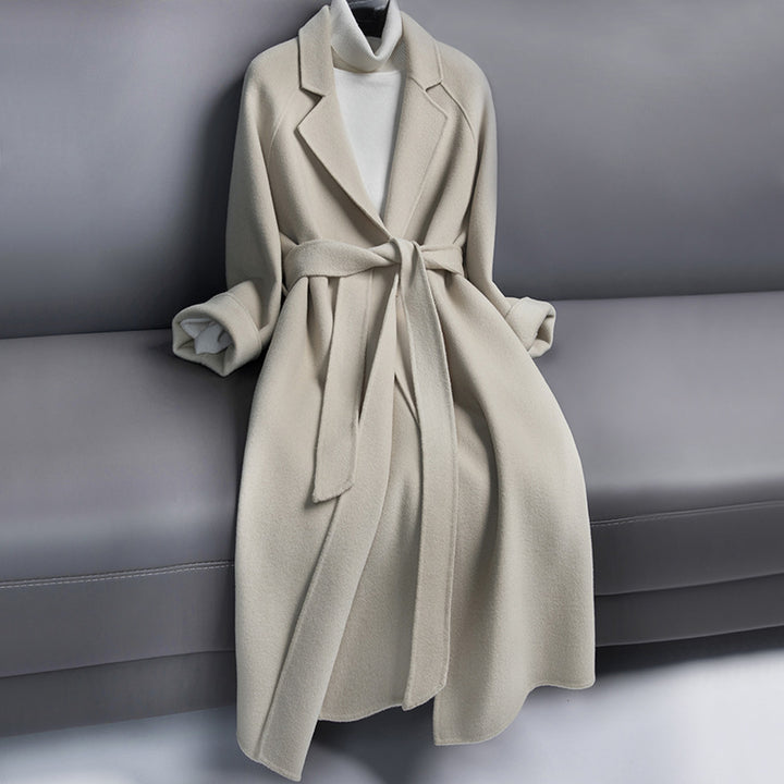 Woman wearing long wool winter coat with belt