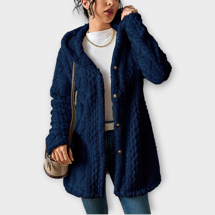 Woman wearing textured hooded winter jacket in relaxed fit