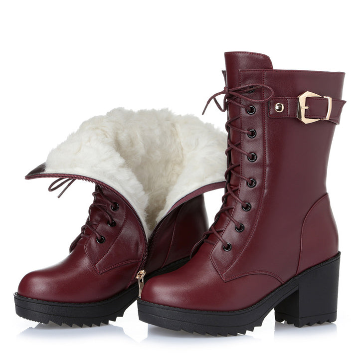 Woman wearing black leather lace-up boots with side zipper