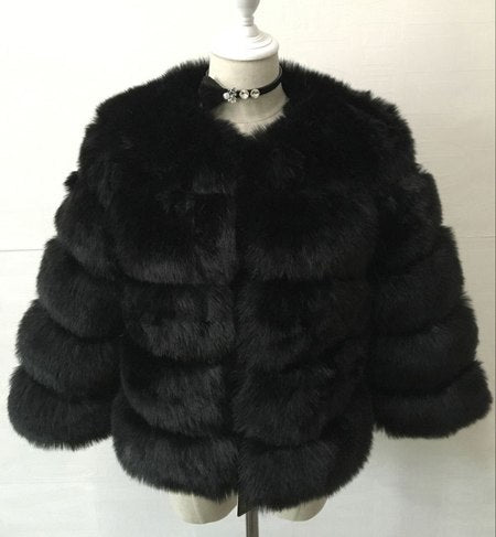 Woman wearing pink short faux fur coat with horizontal panels