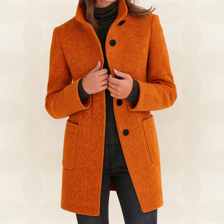 Woman wearing high collar button front coat outdoors