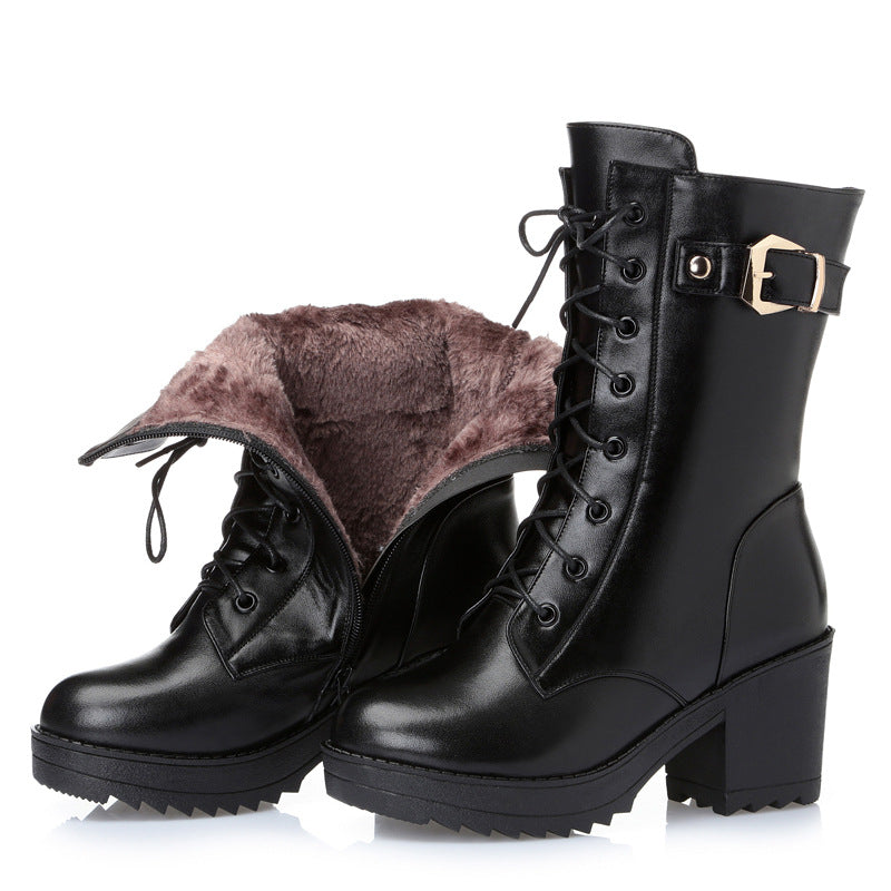 Woman wearing black leather lace-up boots with side zipper