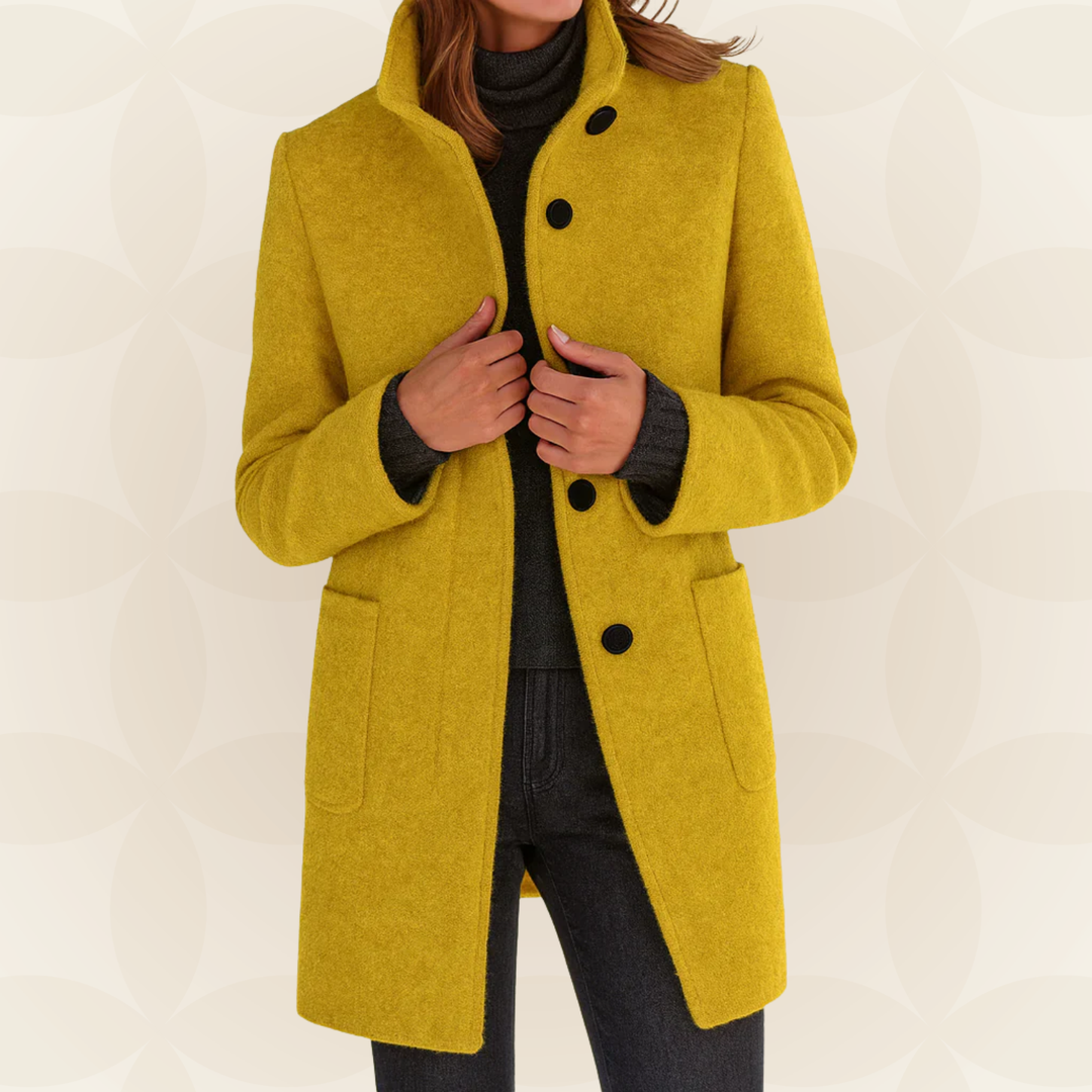 Woman wearing high collar button front coat outdoors