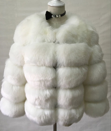 Woman wearing pink short faux fur coat with horizontal panels