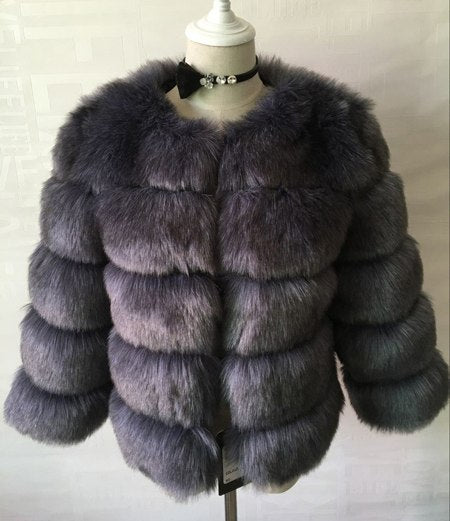 Woman wearing pink short faux fur coat with horizontal panels