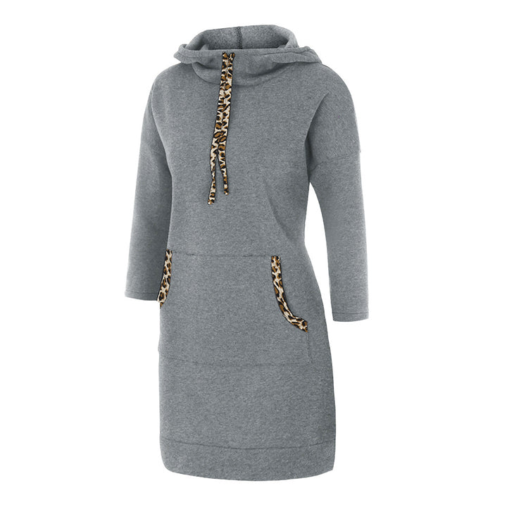 Woman wearing hooded sweatshirt dress with leopard-print drawstrings