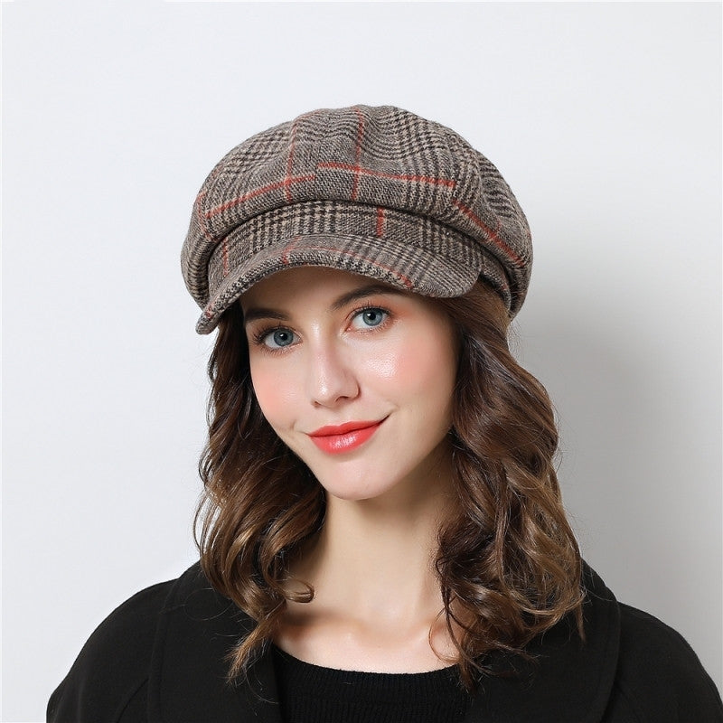 Women's winter beanie hat with fluffy pompom on top