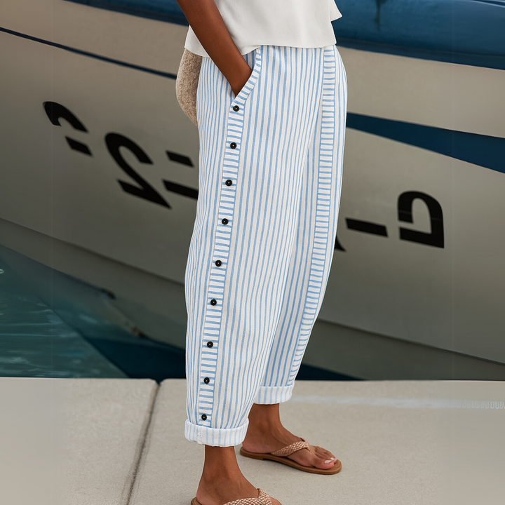 Woman wearing striped button front high waist pants