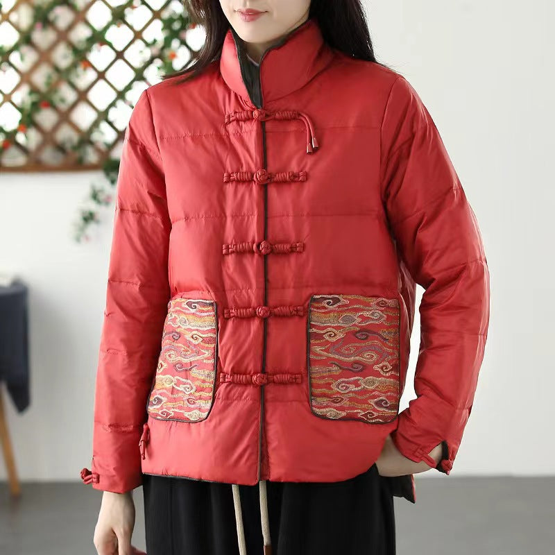 Woman wearing short embroidered down jacket with long sleeves