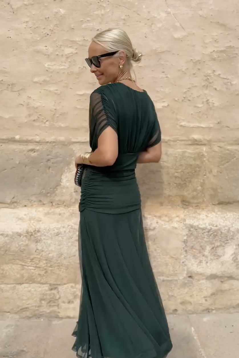 Woman wearing floral print V-neck maxi dress