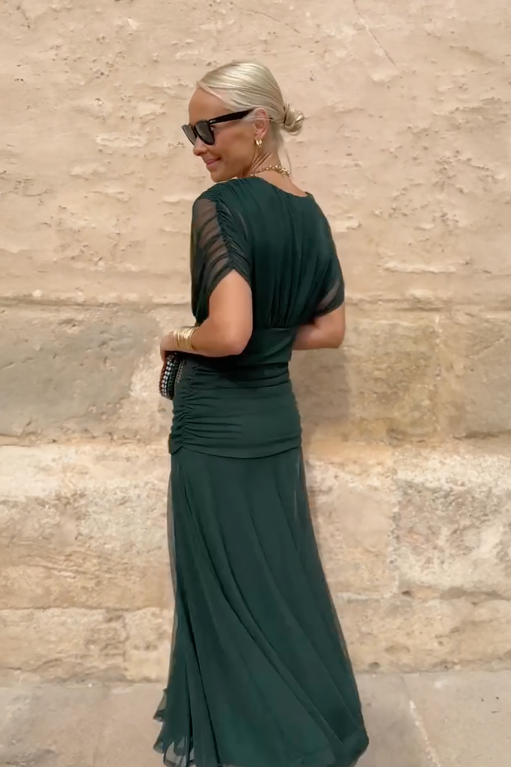 Woman wearing floral print V-neck maxi dress