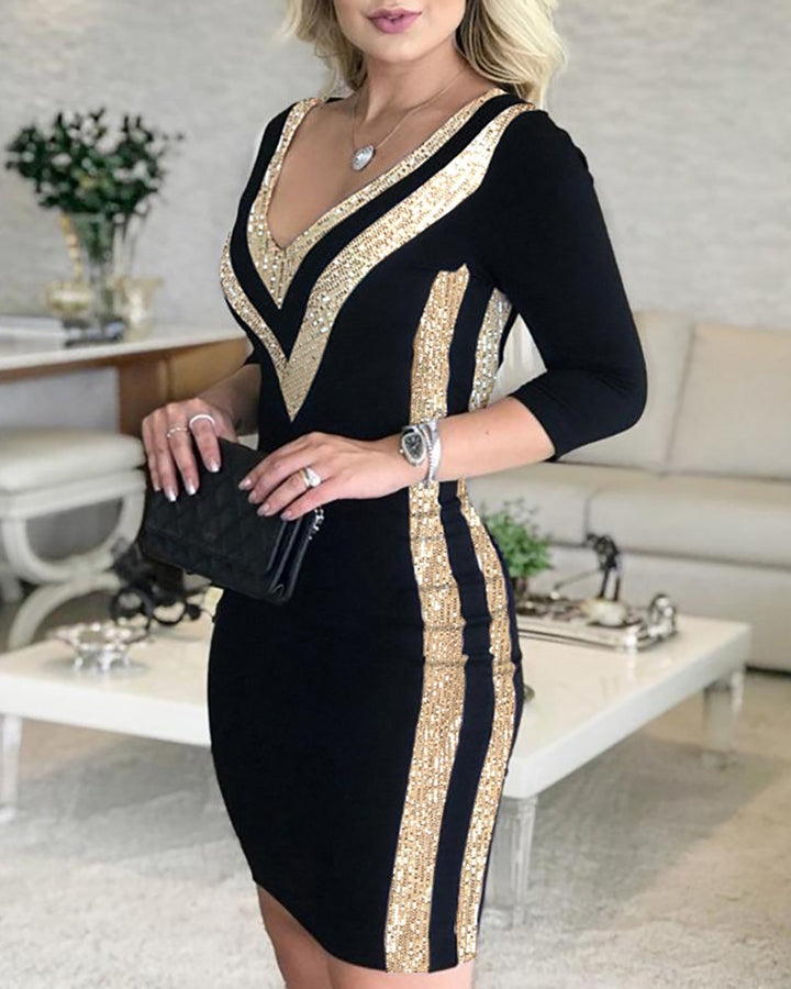 Woman wearing black and white sequin stitched printed dress