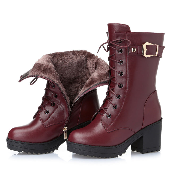 Woman wearing black leather lace-up boots with side zipper