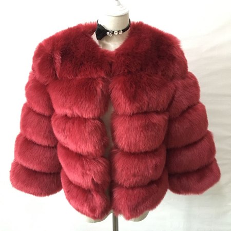 Woman wearing pink short faux fur coat with horizontal panels