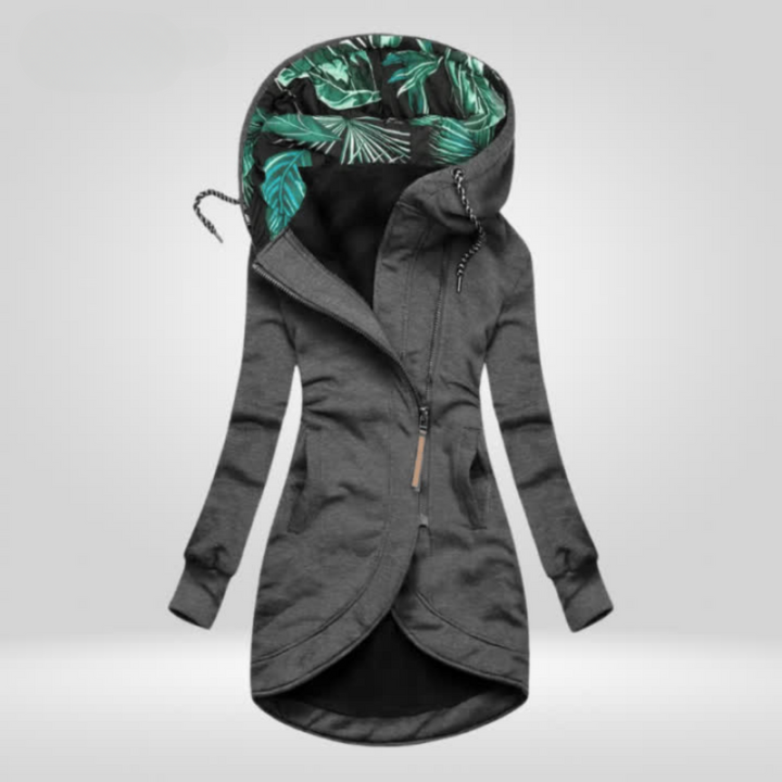 Woman wearing hooded rain coat with slim fit