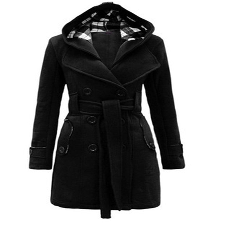 Woman wearing double-breasted winter coat with large collar