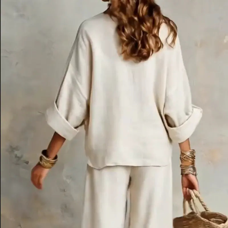 Woman wearing relaxed V-neck two piece set with wide-leg trousers