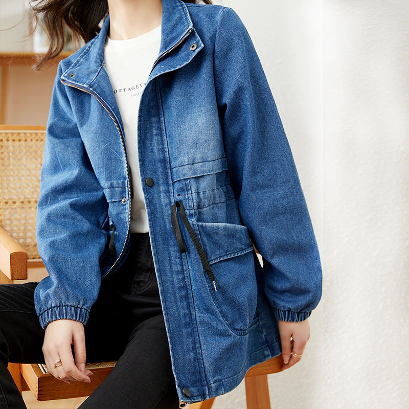 Woman wearing blue denim jacket with drawstring waist