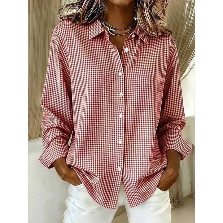 Woman wearing gingham button-front blouse with long sleeves