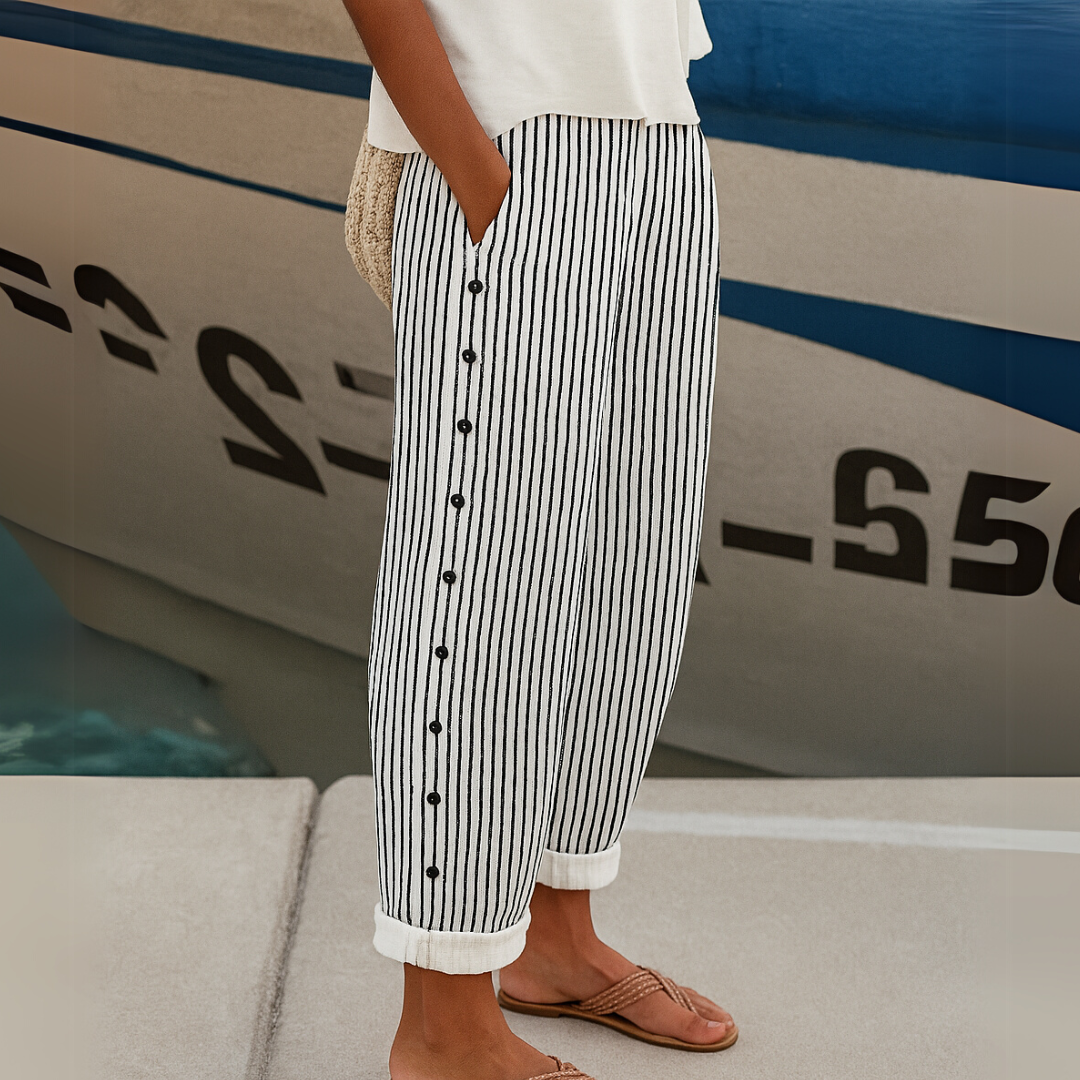Woman wearing striped button front high waist pants