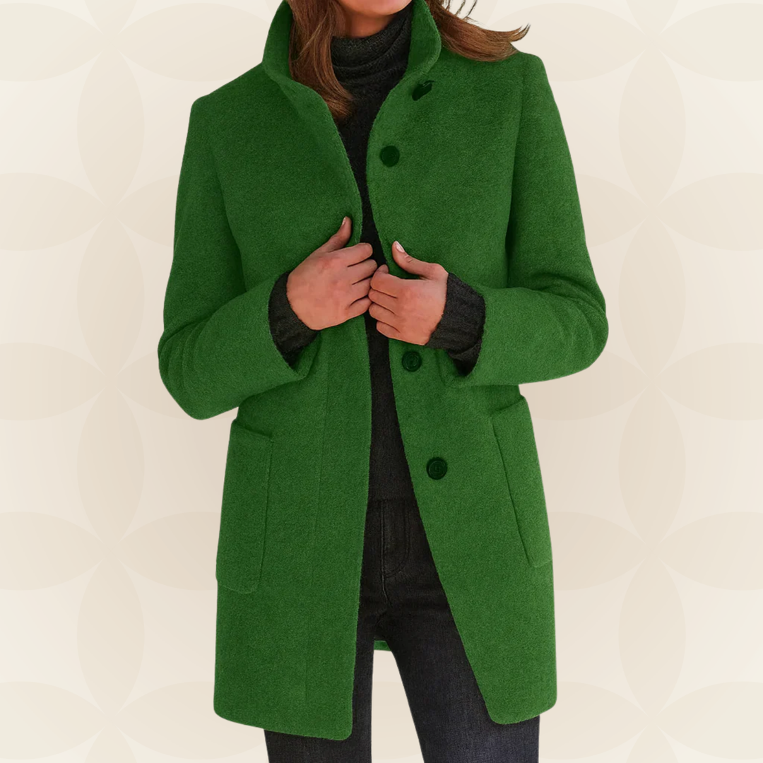 Woman wearing high collar button front coat outdoors