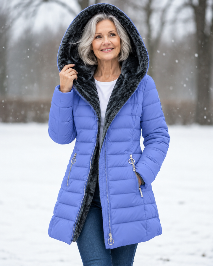 Woman wearing quilted hooded winter coat with A-line fit