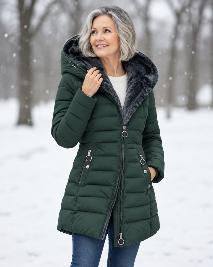 Woman wearing quilted hooded winter coat with A-line fit