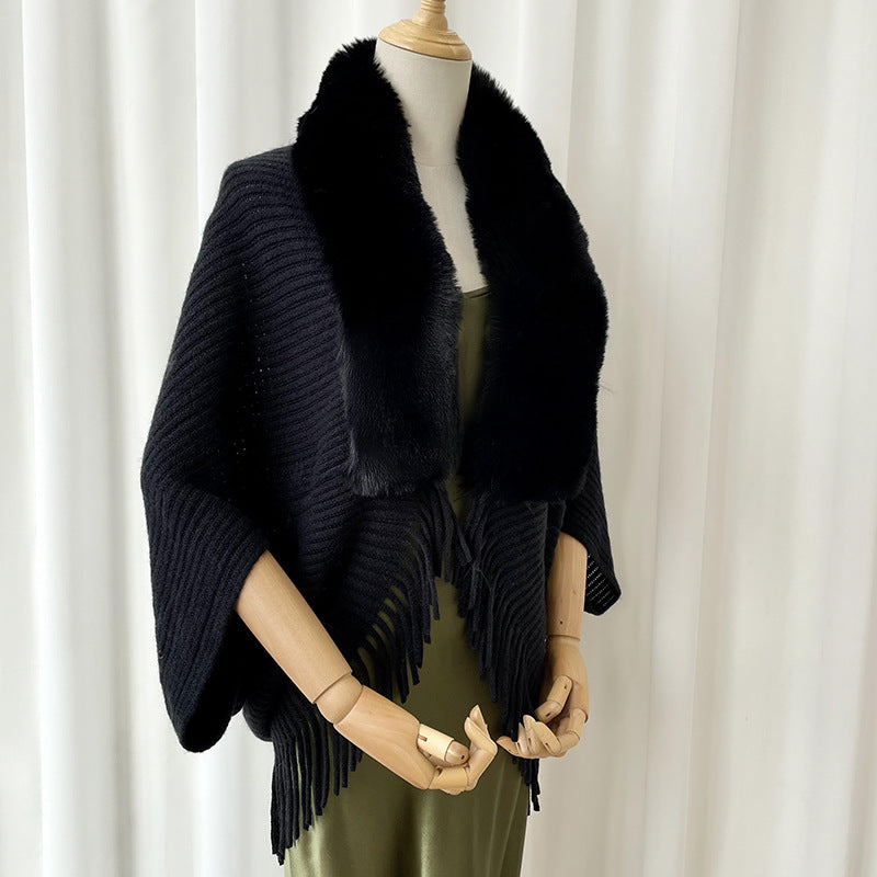 Women's solid color knit winter shawl draped over shoulders