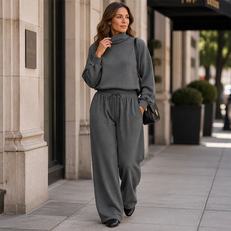 Woman wearing black turtleneck two-piece set with wide-leg trousers