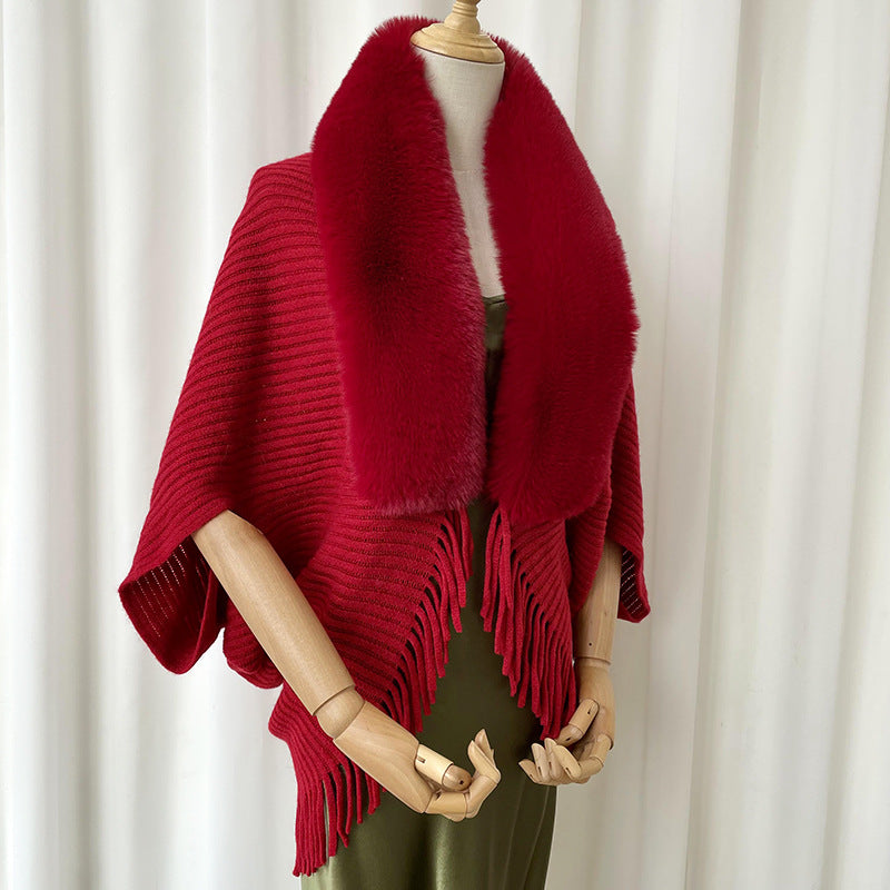 Women's solid color knit winter shawl draped over shoulders