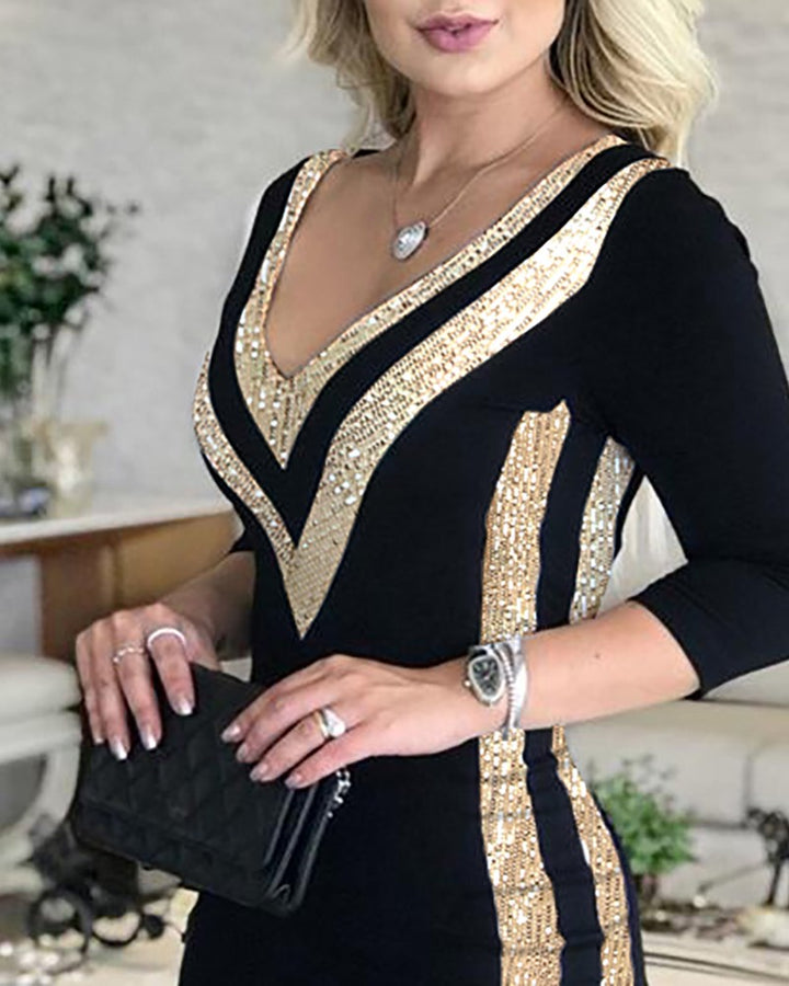 Woman wearing black and white sequin stitched printed dress