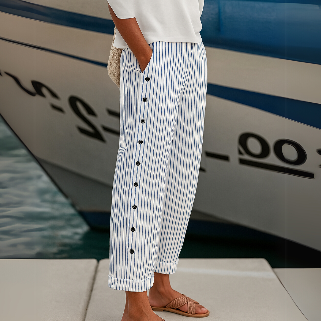 Woman wearing striped button front high waist pants