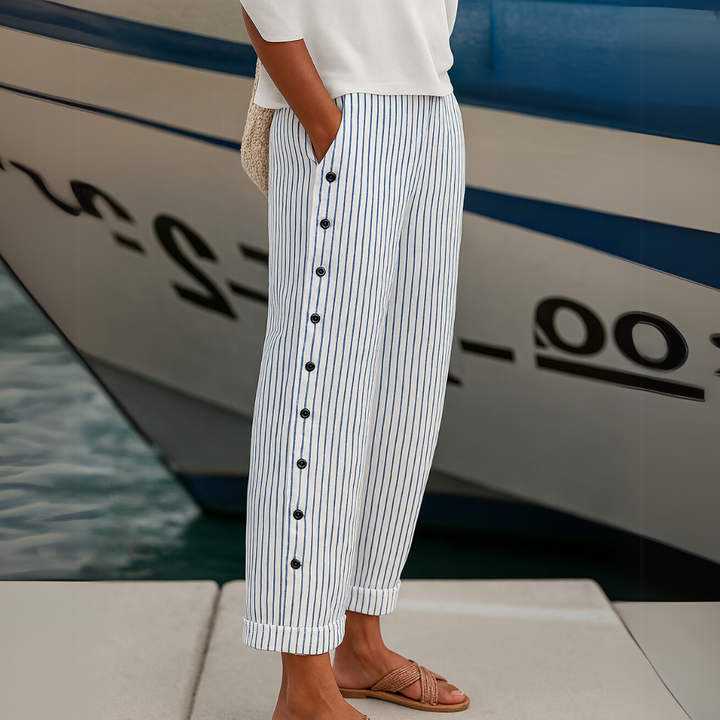 Woman wearing striped button front high waist pants