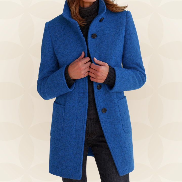 Woman wearing high collar button front coat outdoors