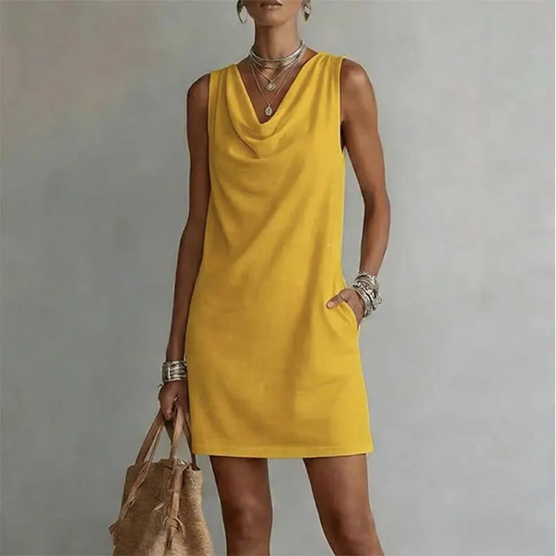 Woman wearing sleeveless mini dress with draped neckline