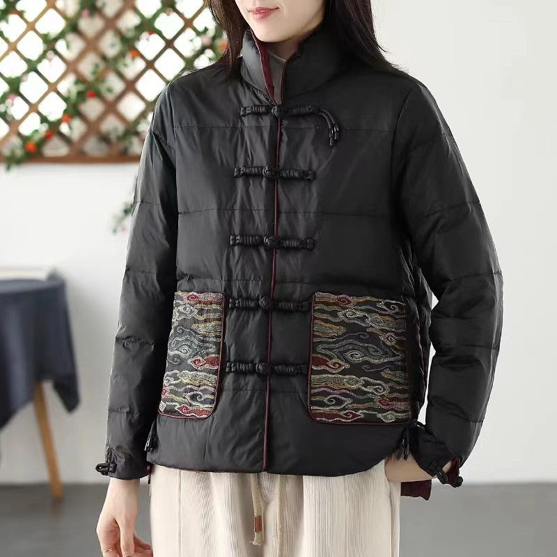 Woman wearing short embroidered down jacket with long sleeves