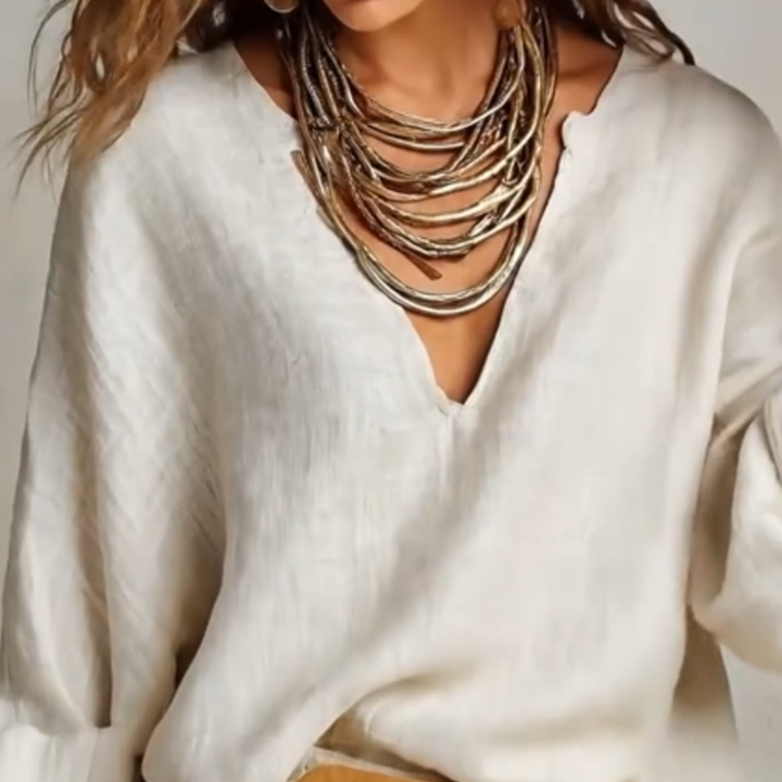 Woman wearing relaxed V-neck two piece set with wide-leg trousers