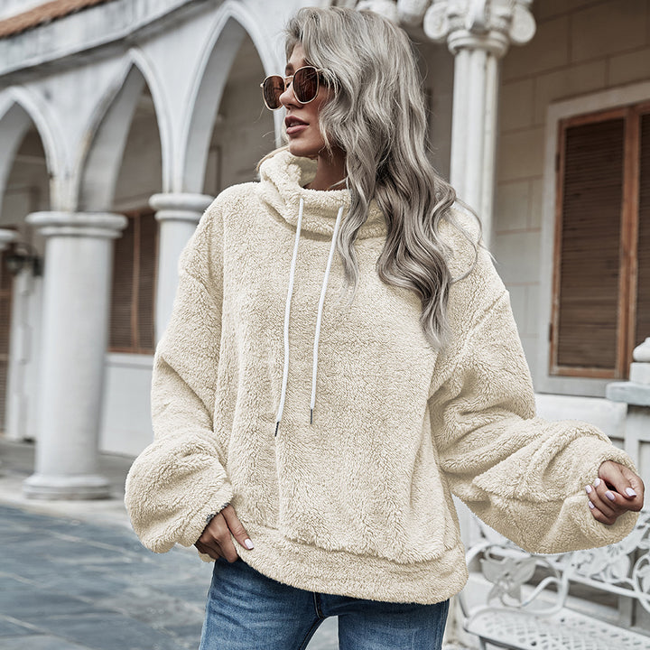 Woman wearing apricot plush hooded sweater with drawstring hood