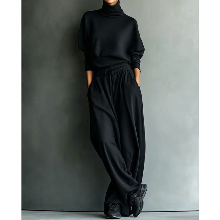 Woman wearing black turtleneck two-piece set with wide-leg trousers