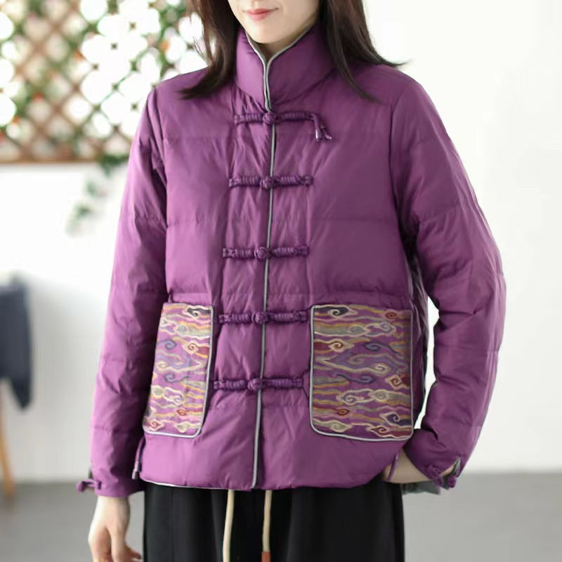 Woman wearing short embroidered down jacket with long sleeves