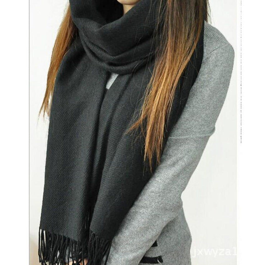 Woman wearing multi-style winter shawl scarf outdoors