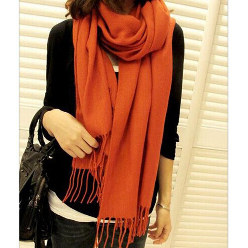 Woman wearing multi-style winter shawl scarf outdoors