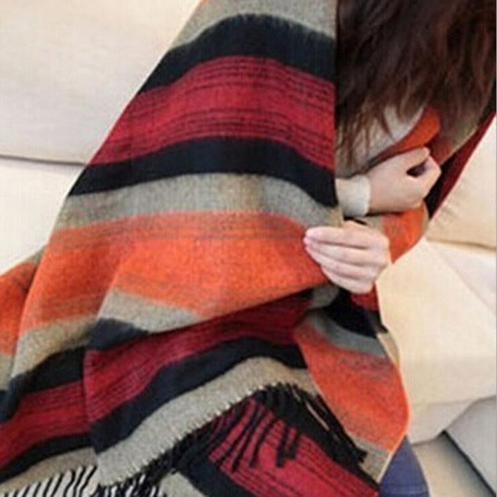 Woman wearing multi-style winter shawl scarf outdoors