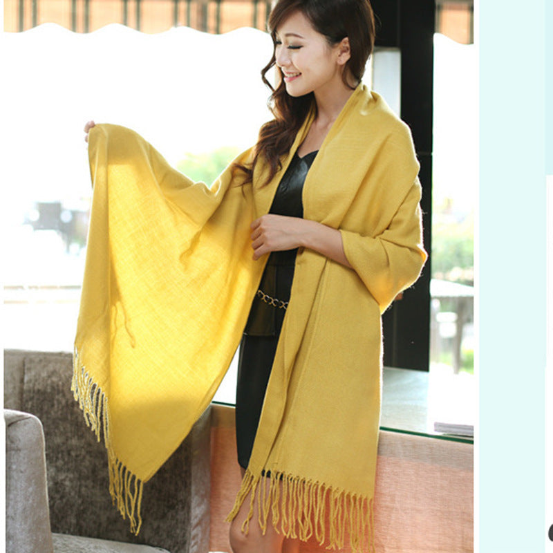 Woman wearing multi-style winter shawl scarf outdoors