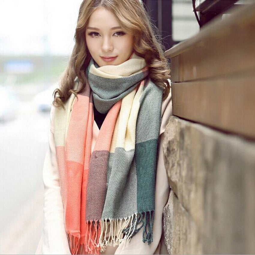Woman wearing multi-style winter shawl scarf outdoors