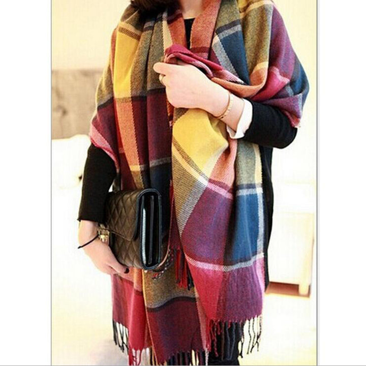 Woman wearing multi-style winter shawl scarf outdoors